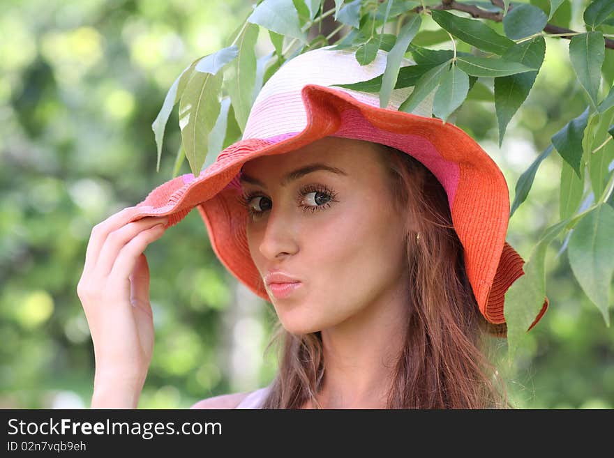 Pretty cheerful woman in the garden. Pretty cheerful woman in the garden