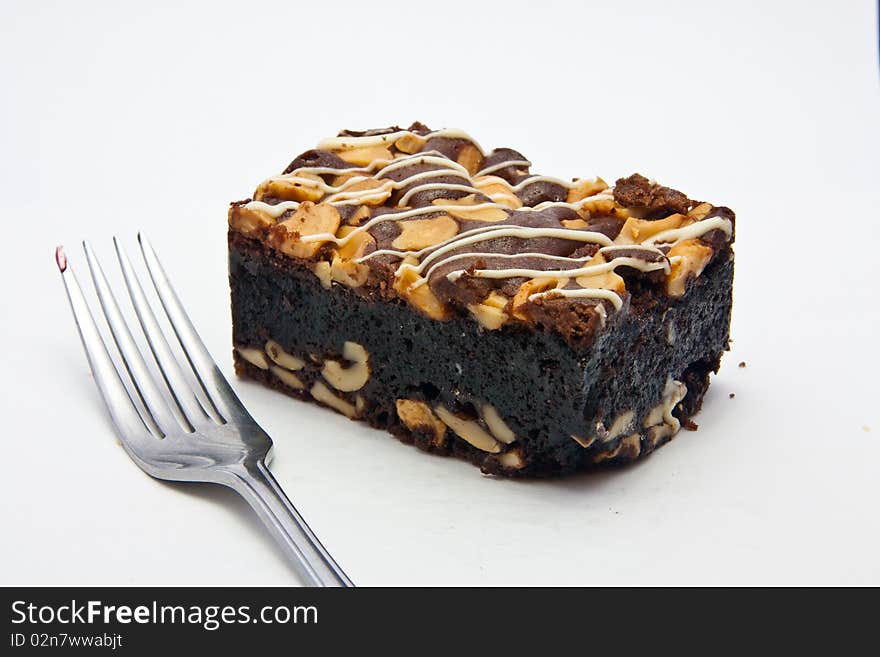 Chocolate cake topping with nuts and cream