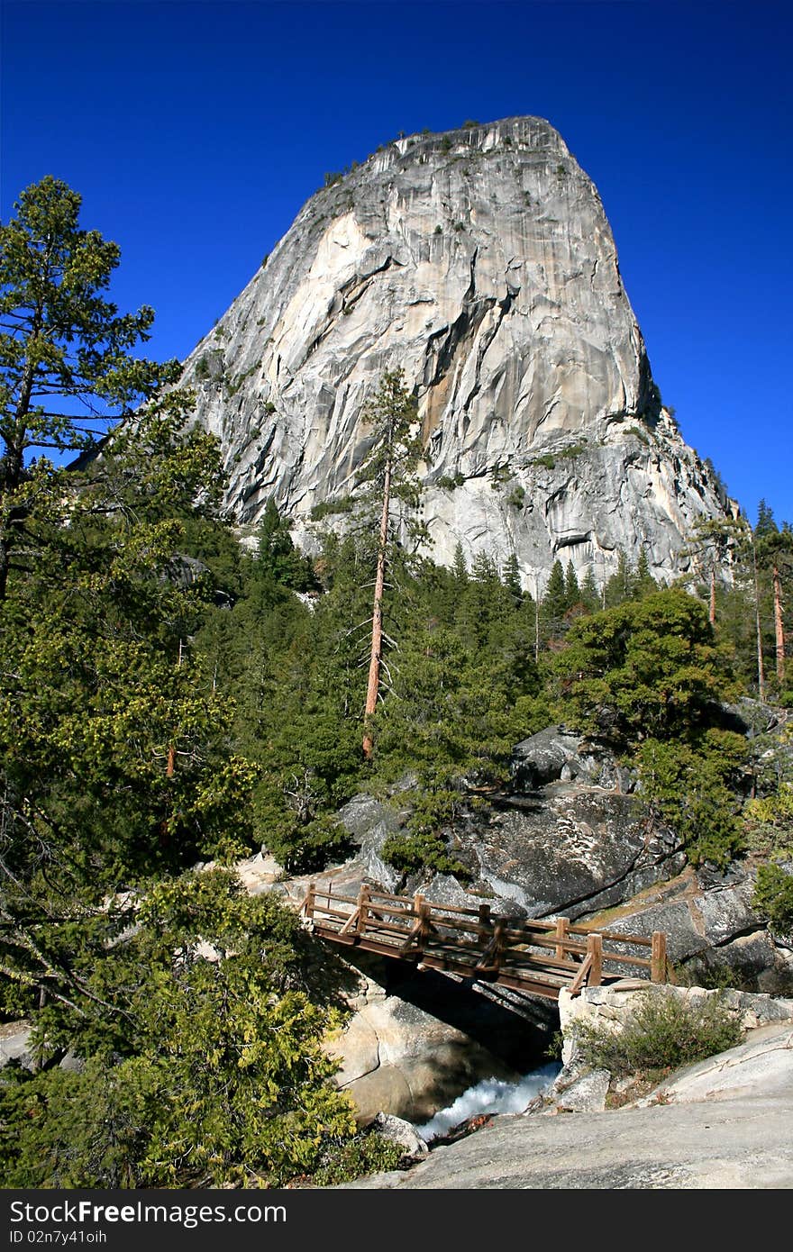 Granite Rock and waterfall bridge at Yosemite National Park. Granite Rock and waterfall bridge at Yosemite National Park