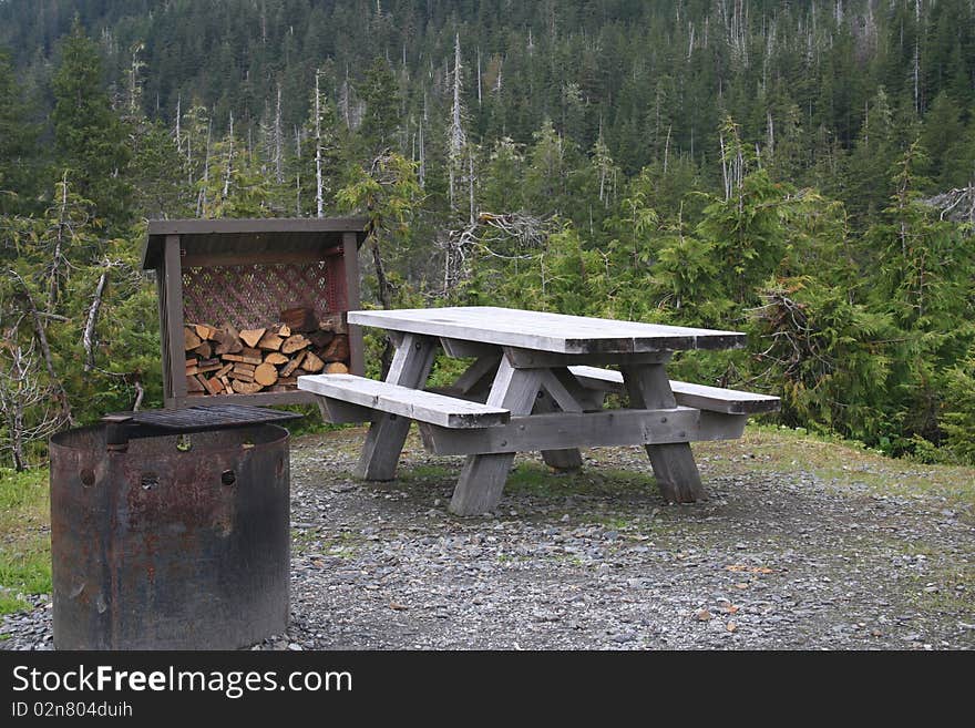 A picnic table, firepit, and firewood in Southeastern Alaska's Tongass National Forest, which is the largest in the USA. A picnic table, firepit, and firewood in Southeastern Alaska's Tongass National Forest, which is the largest in the USA.