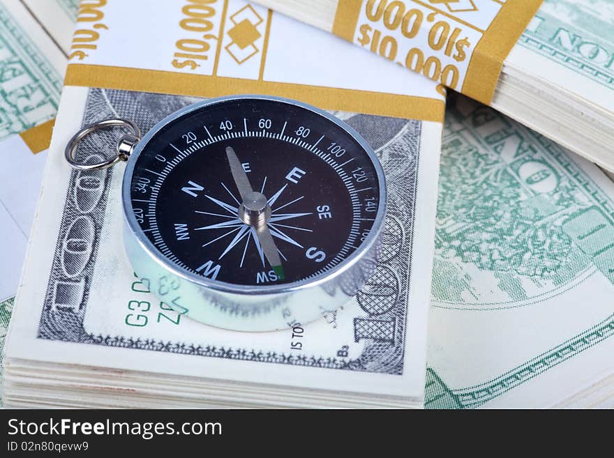 Close up US Currency and compass concept
