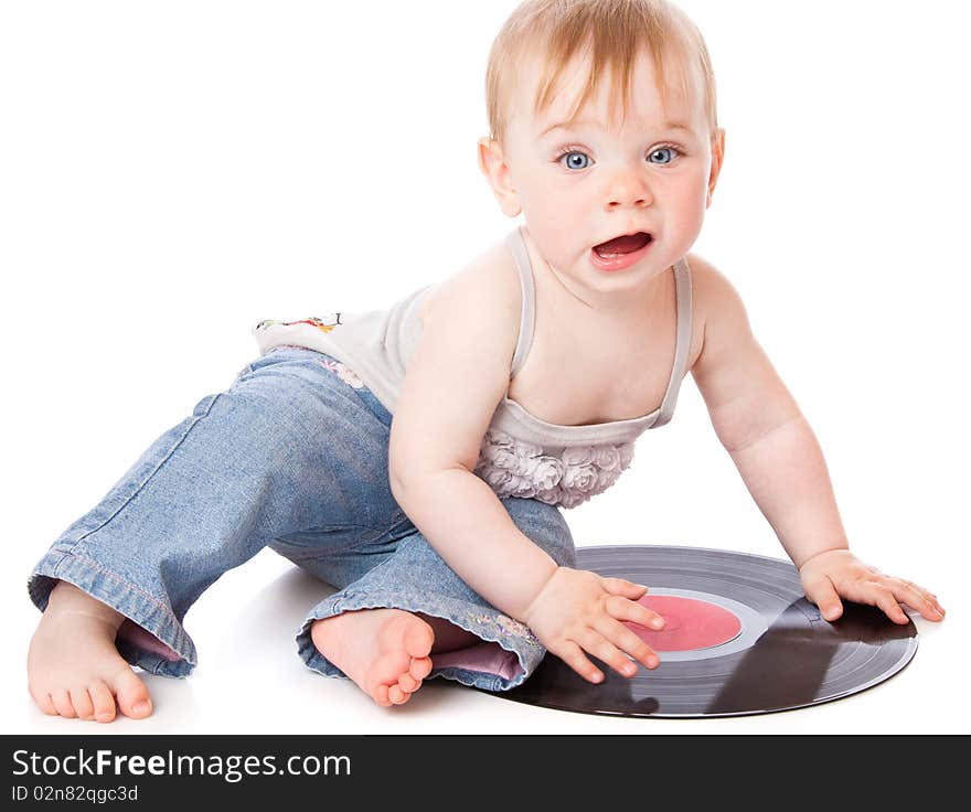 The small child with a black gramophone record. Isolated on white background