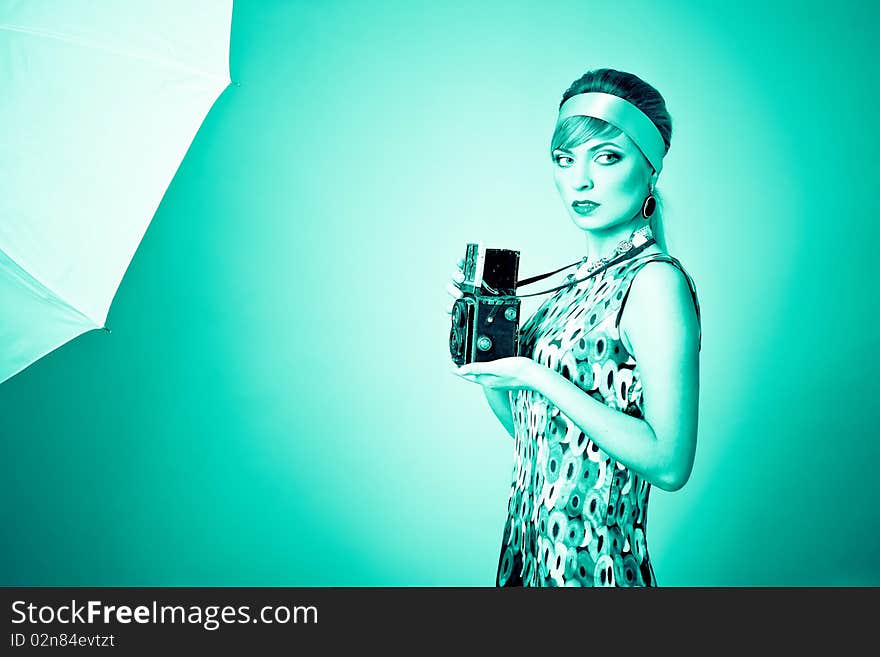 Beautiful fashion girl on the turquoise background