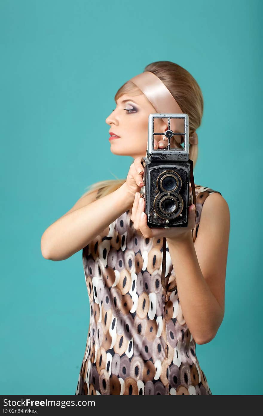 Beautiful Fashion Girl On The Turquoise Background