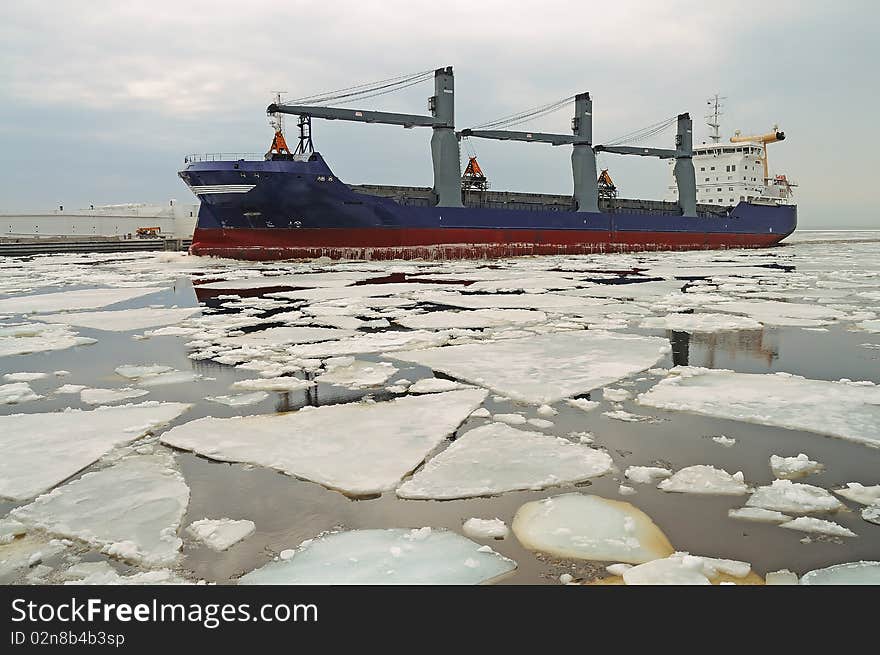 Cargo ship in ice. Moving