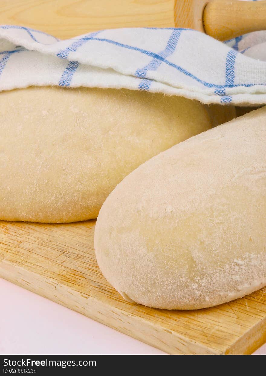 Wheat bread dough. Close up on white background