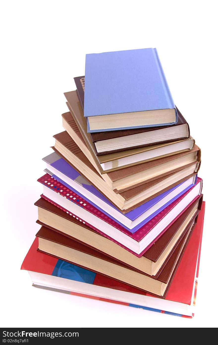 A lot of books, tower made of books against a white background. A lot of books, tower made of books against a white background