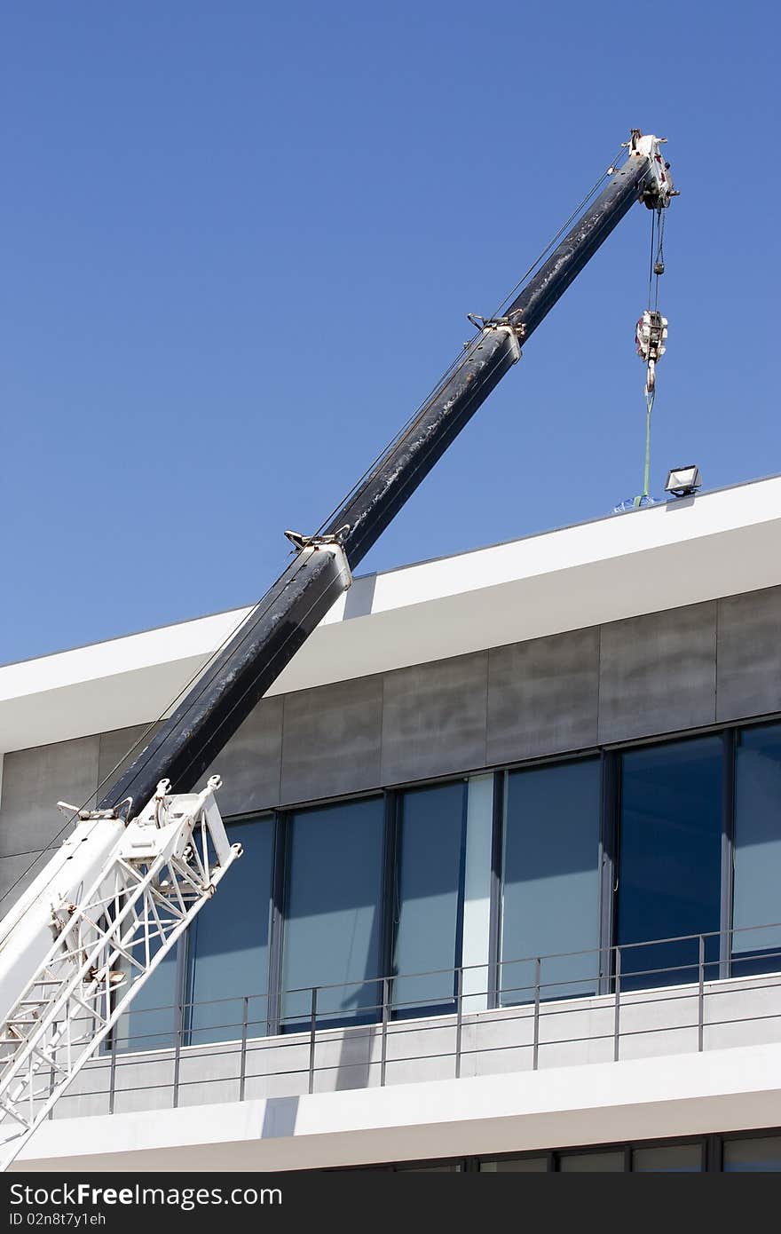 Mobile construction crane delivering materials