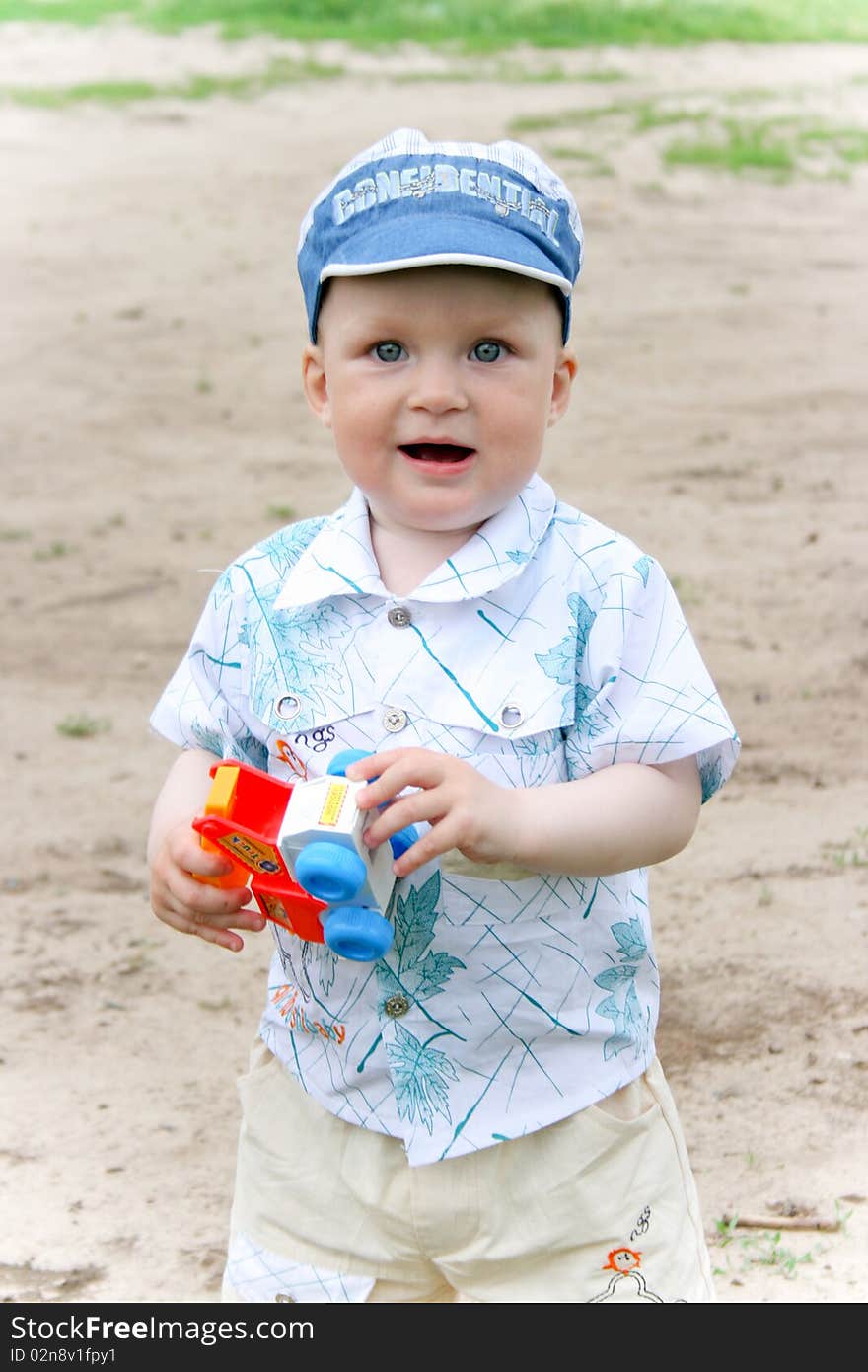 Boy playing with toy outdoors