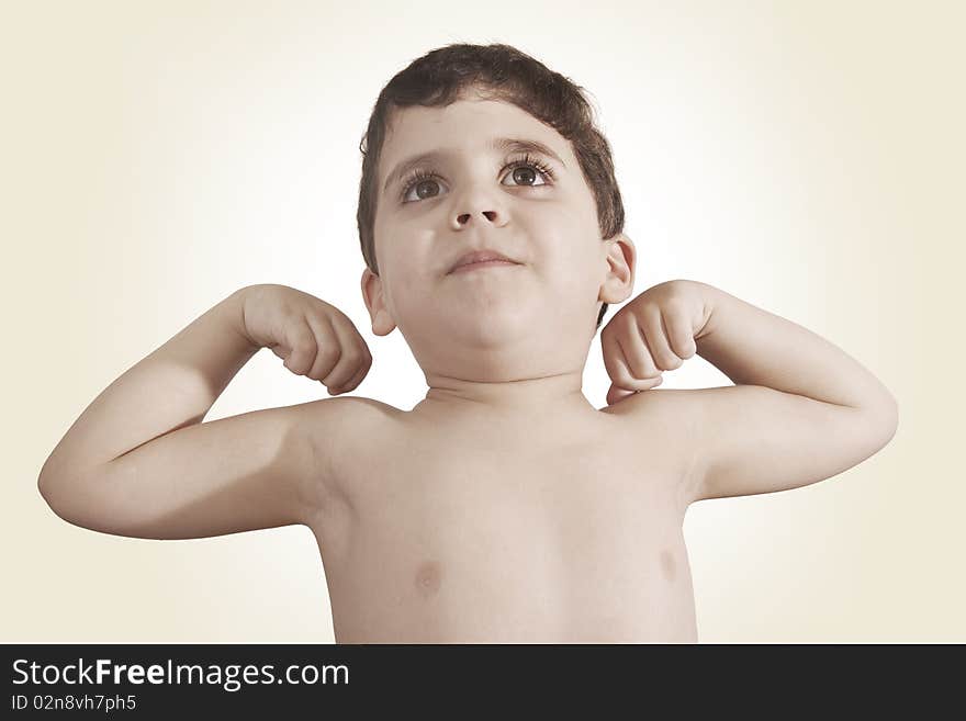 Child with arms in air, showing off his muscles or cheering. Child with arms in air, showing off his muscles or cheering