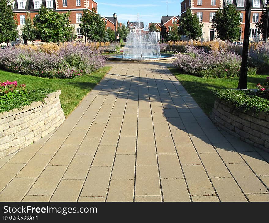 A water fountain in the middle of a park.