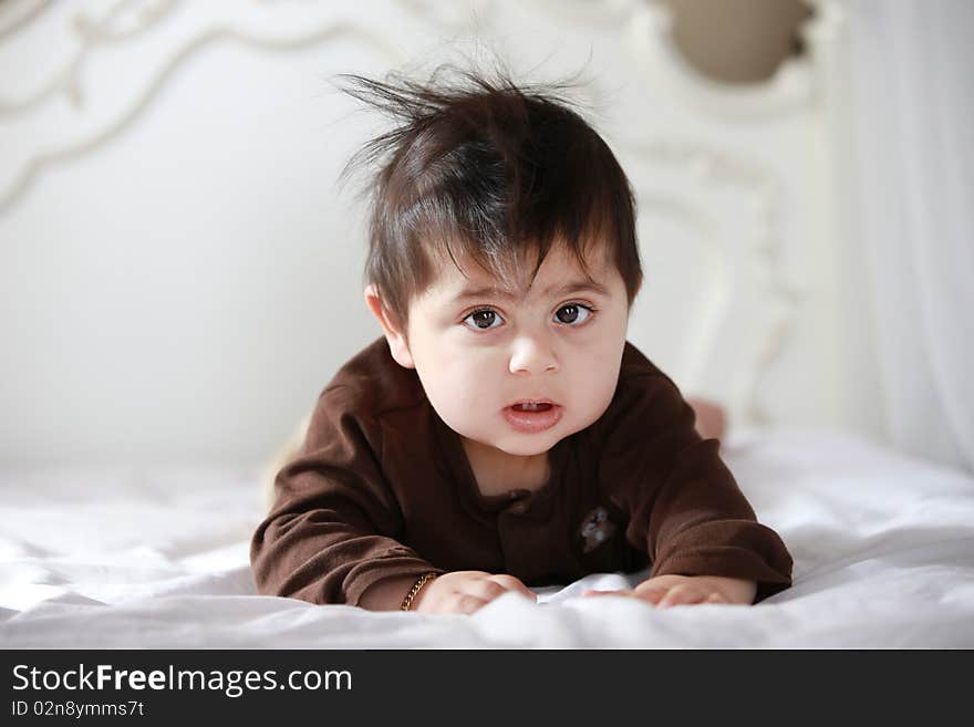 Little baby in bed after waking up from his nap.