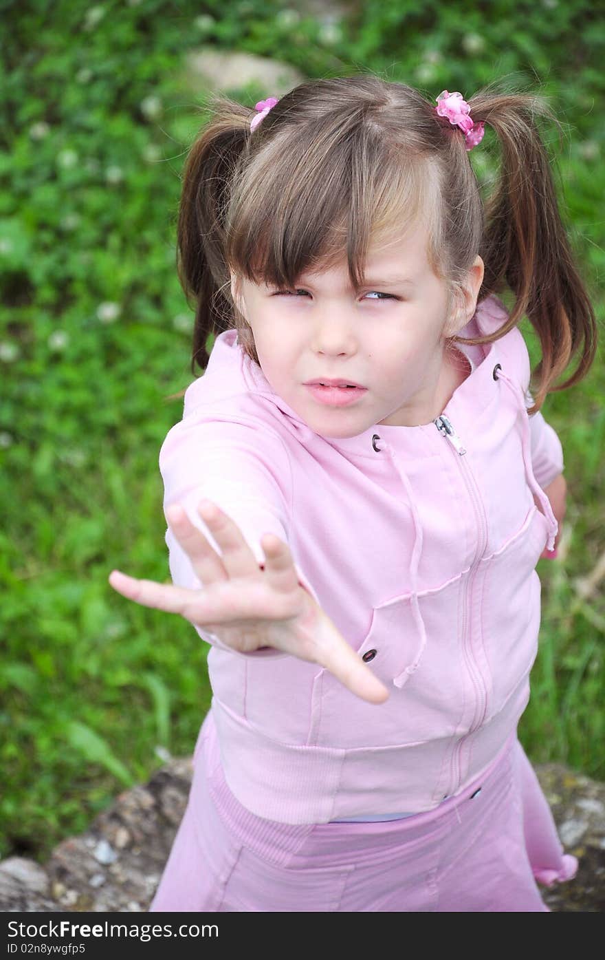 Girl gives hand in pink