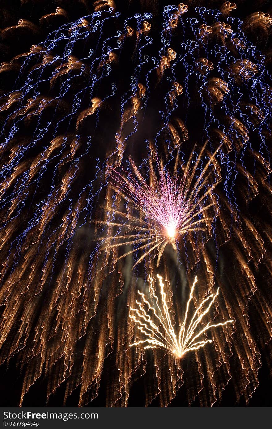 Fourth of July fireworks in an artistic squiggle pattern. Fourth of July fireworks in an artistic squiggle pattern.