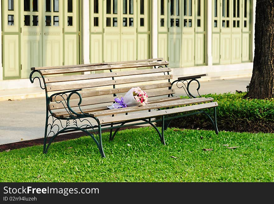 Bouquet on bench in the park.