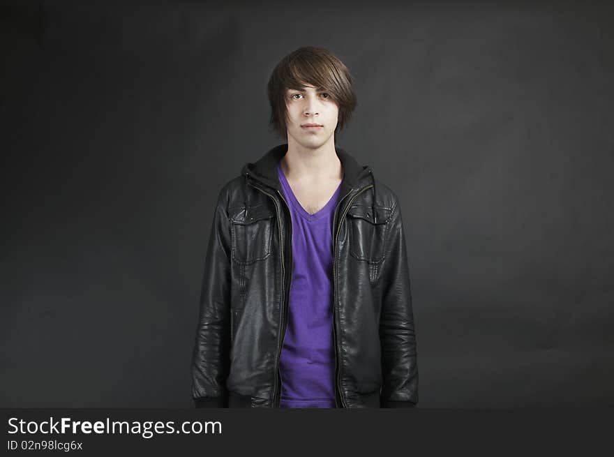 Young adult male Caucasian wearing a leather jacket. Young adult male Caucasian wearing a leather jacket