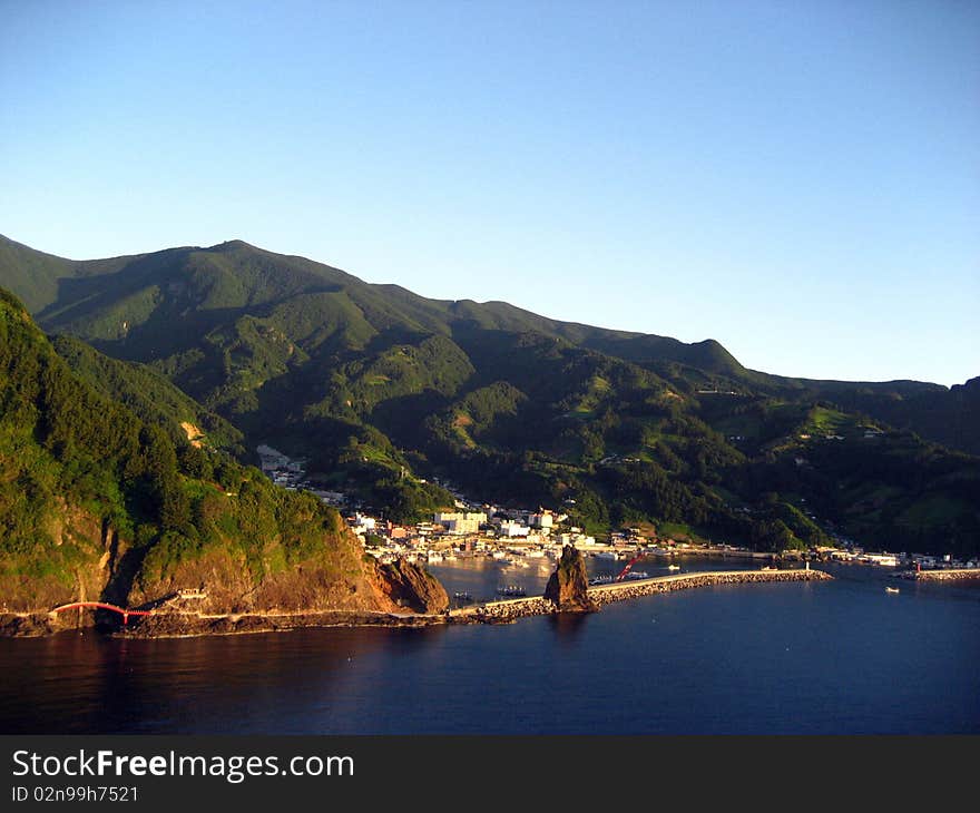 Fishing village between mountains and ocean on the Dokjdo Islands in korea, asia. Fishing village between mountains and ocean on the Dokjdo Islands in korea, asia