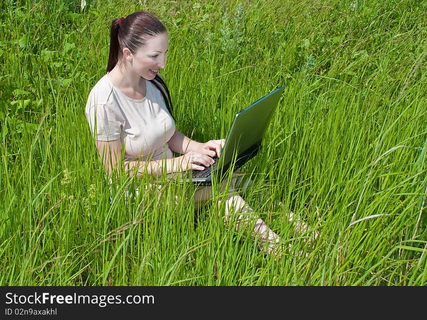 Beautiful Girl Setting Outdoor With Laptop  Summer