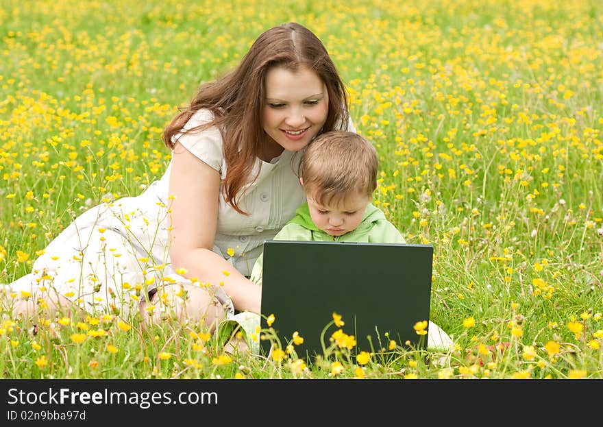 Young mum with the son on the nature. Young mum with the son on the nature