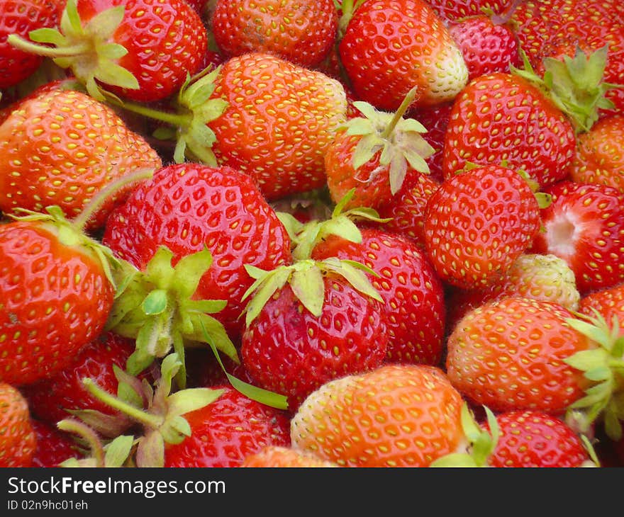 Wallpapers from a ripe red strawberry closeup. Wallpapers from a ripe red strawberry closeup