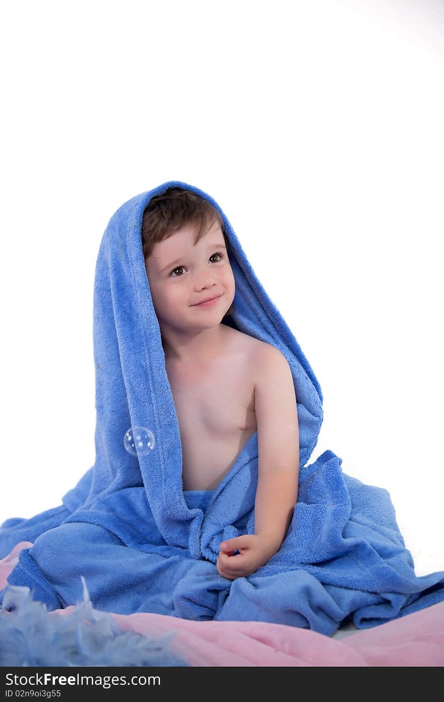 Little boy in towel looking away. Little boy in towel looking away