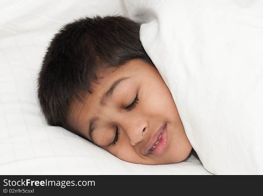 A handsome indian kid smiling for you