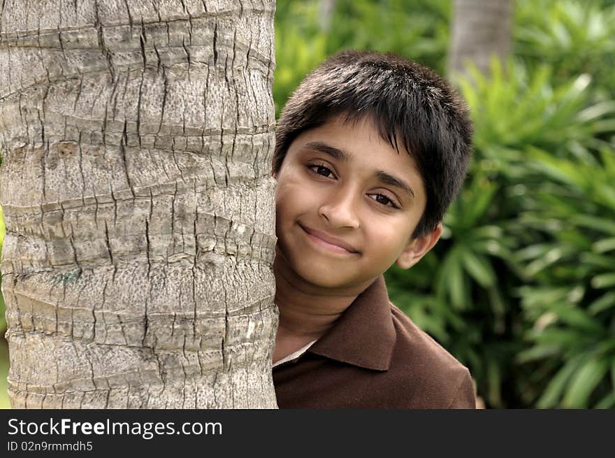 Handsome indian kid looking eagerly to the camera