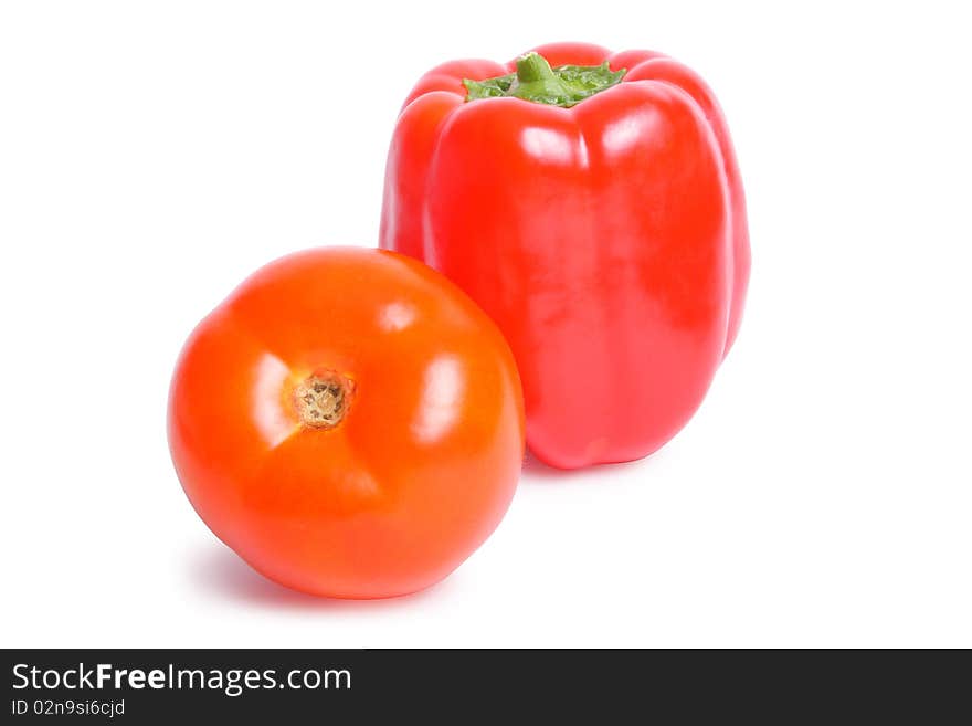 Tomato and pepper on white background (isolated, clipping path)