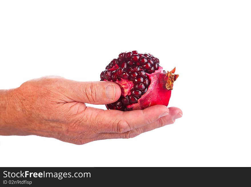 Image of a hand giving a Fresh Broken Pomegranate. Image of a hand giving a Fresh Broken Pomegranate