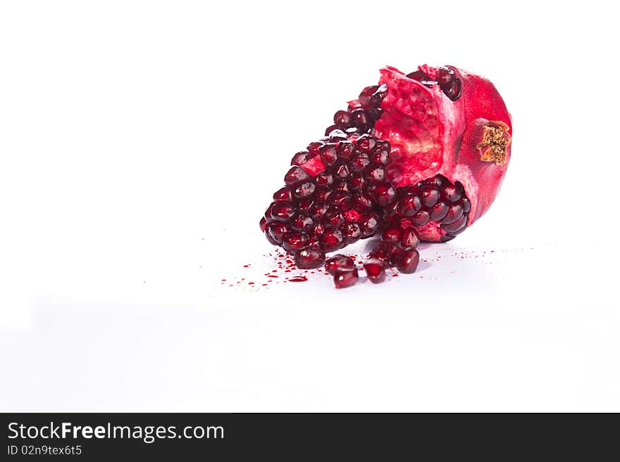 Image of a Pomegranate broken and isolated. Image of a Pomegranate broken and isolated