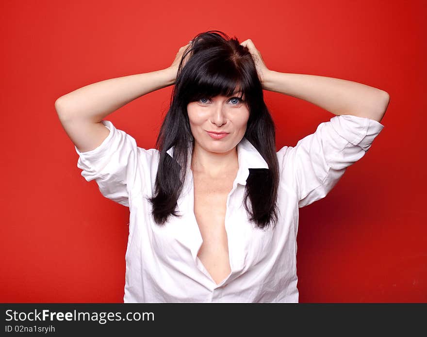 Woman's portrait on red background. Woman's portrait on red background