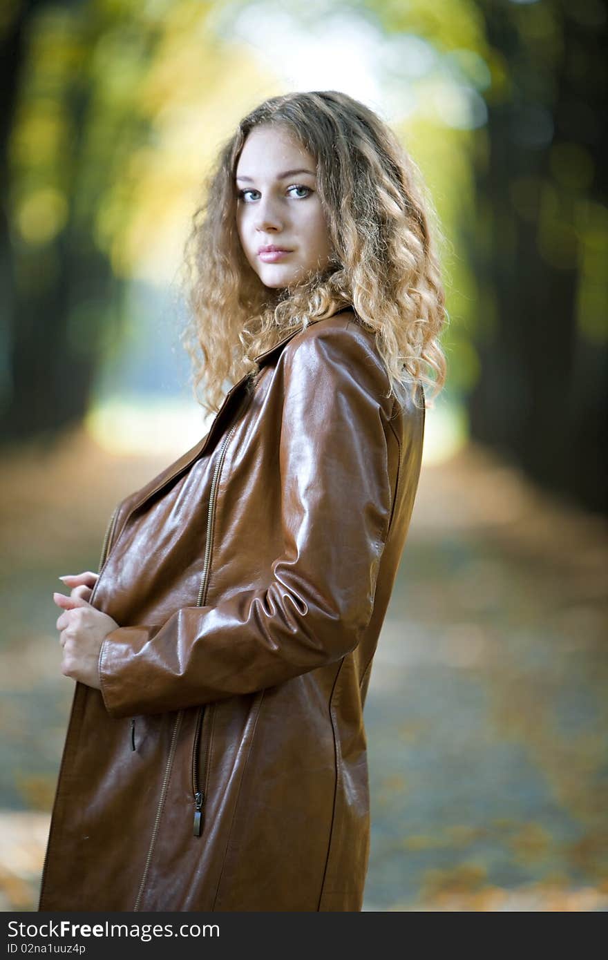 Young beauty woman in autumn outdoor