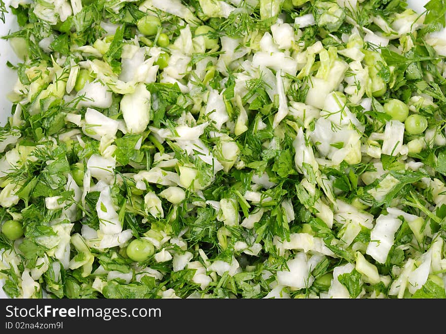 Fresh salad from vegetables and greens on a plate. Fresh salad from vegetables and greens on a plate