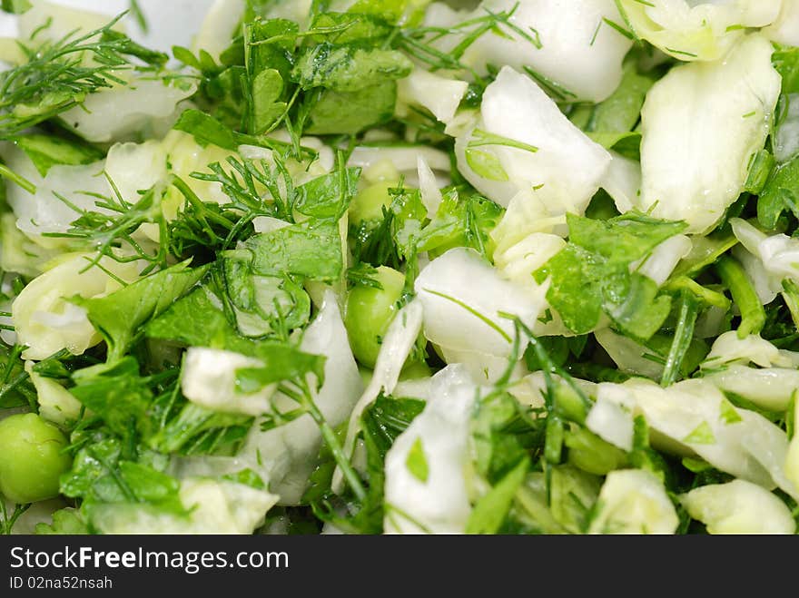 Fresh salad from vegetables and greens on a plate. Fresh salad from vegetables and greens on a plate