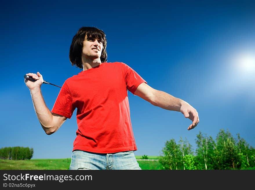 Man in jeans with racket. Man in jeans with racket