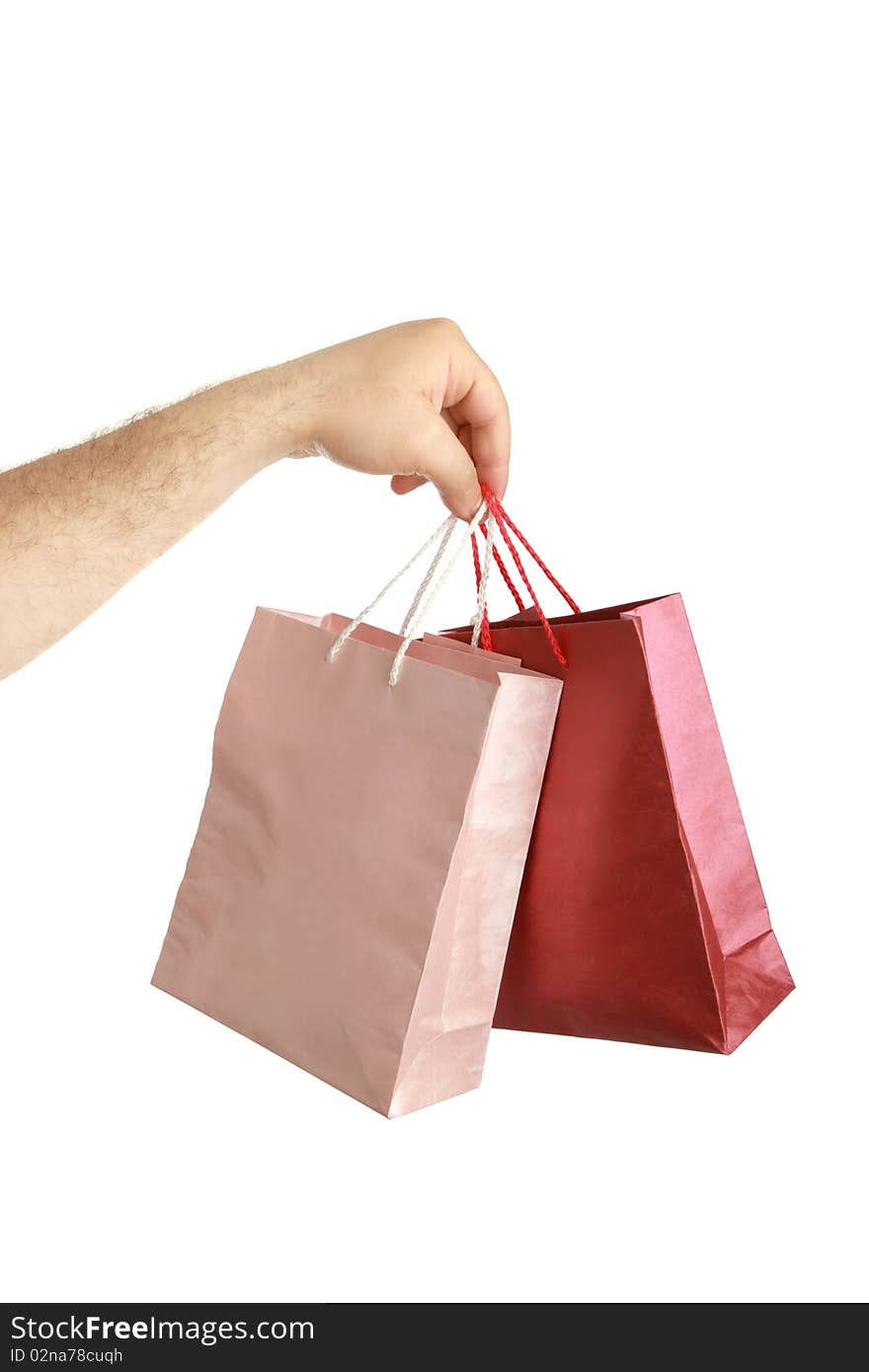 Paper bags in male hand isolated background