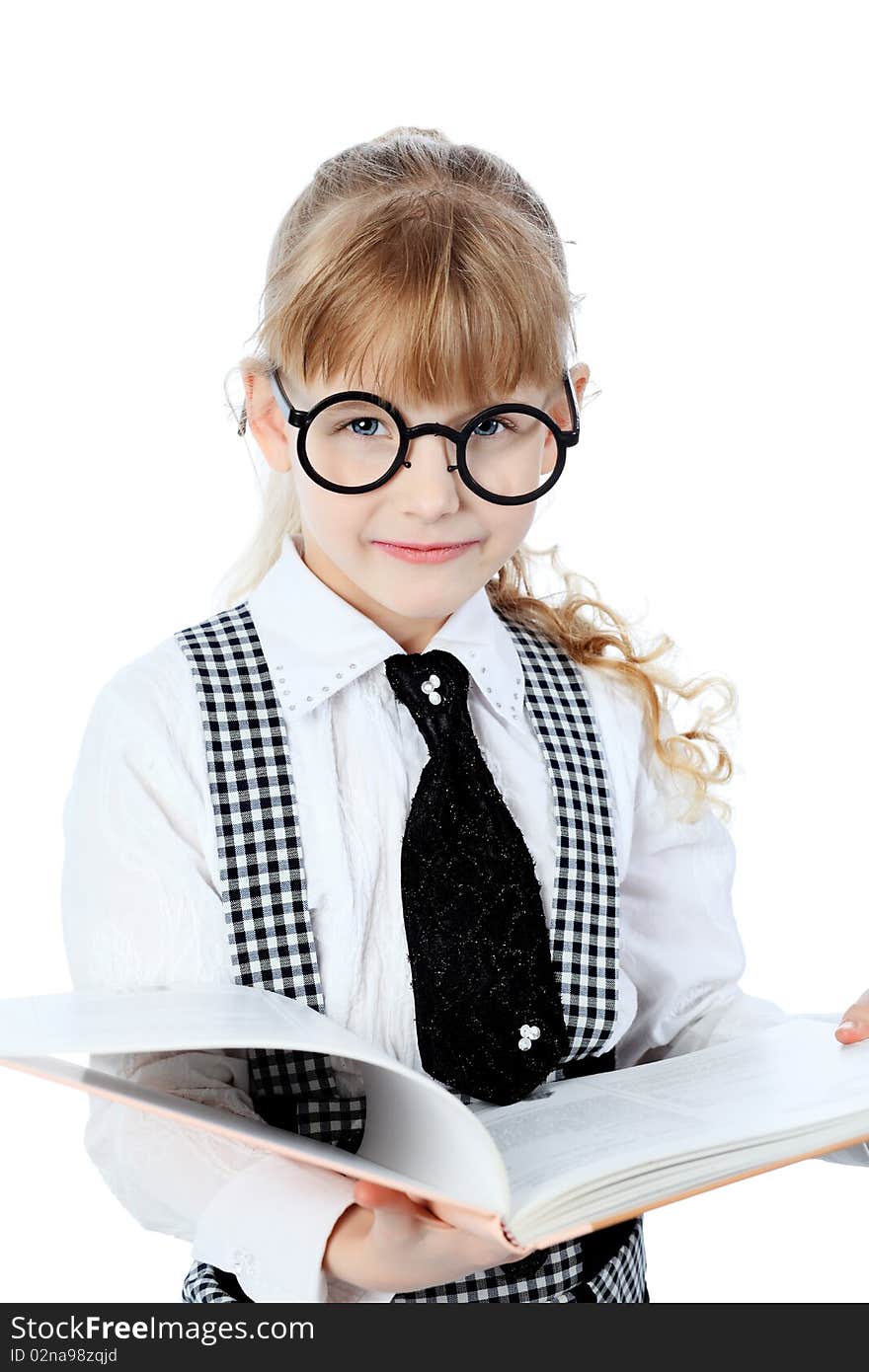 Shot of a little girl in glasses standing with books. Isolated over white background. Shot of a little girl in glasses standing with books. Isolated over white background.