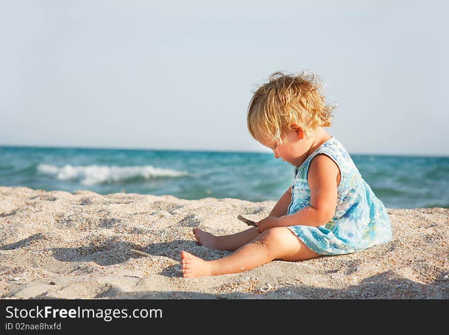 Cute Toddler Girl On Beach