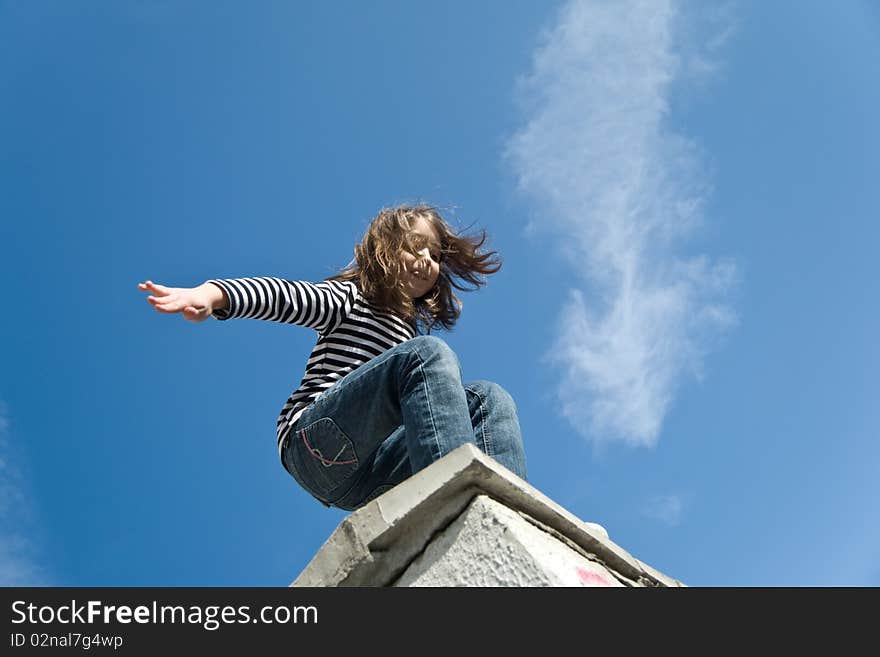 Little girl preparing to a big jump