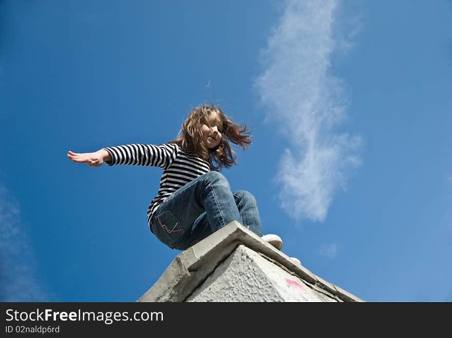 Little girl preparing to a big jump