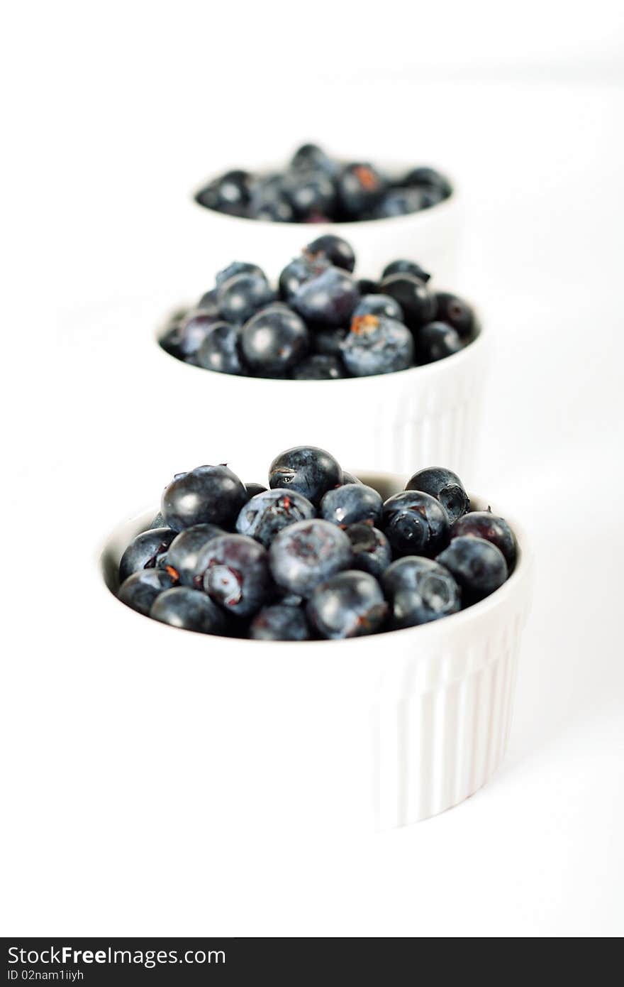 Fresh organic blueberries in ramekins