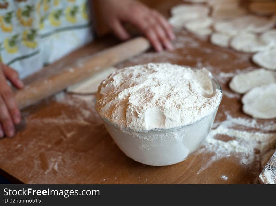 An image of a pot with flour on the table