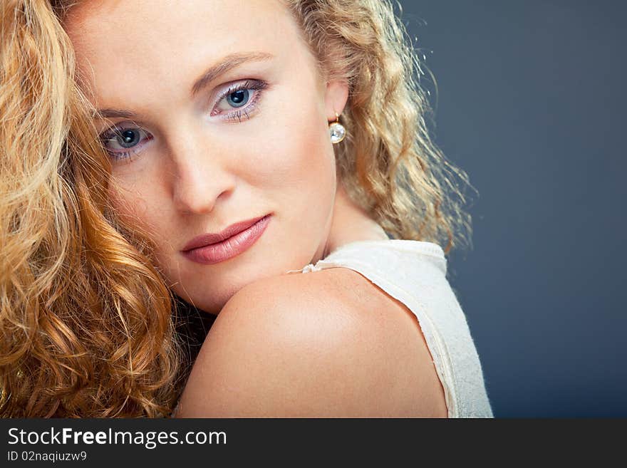 Portrait of beautiful lady on blue