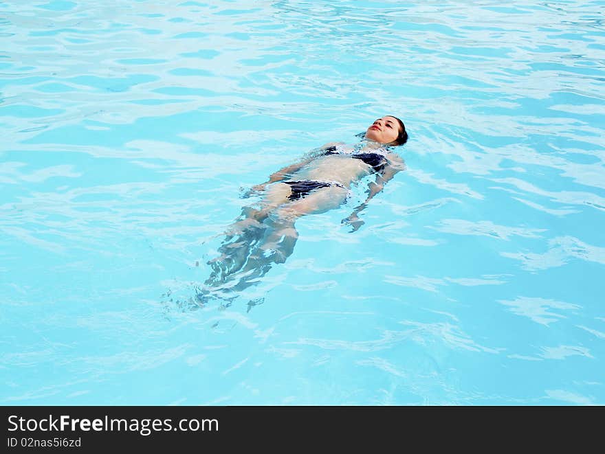 Girl in the pool alone. Girl in the pool alone