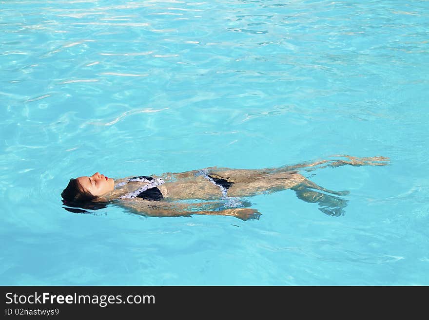 Girl in the pool alone. Girl in the pool alone