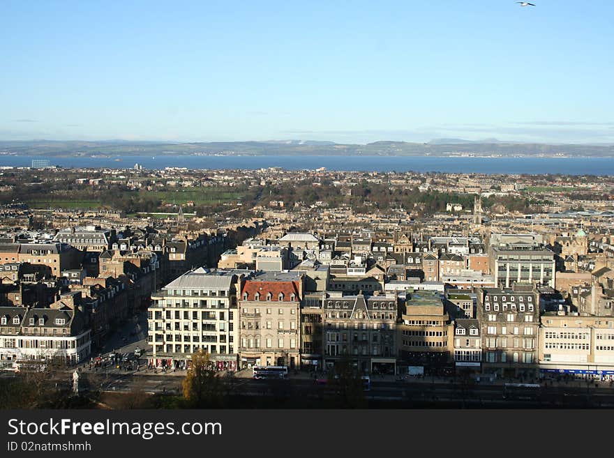 Taken from Edinburgh Castle this photograph looks North over Edinburgh and out to the sea. Taken on St. Andrews Day (November 30th) 2009, the patron saint of Scotland. Wonderful view of Prince's Street, the shadow from the Castle and the beautiful architecture. Taken from Edinburgh Castle this photograph looks North over Edinburgh and out to the sea. Taken on St. Andrews Day (November 30th) 2009, the patron saint of Scotland. Wonderful view of Prince's Street, the shadow from the Castle and the beautiful architecture.