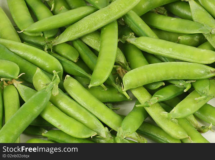 Delicious fresh green peas background