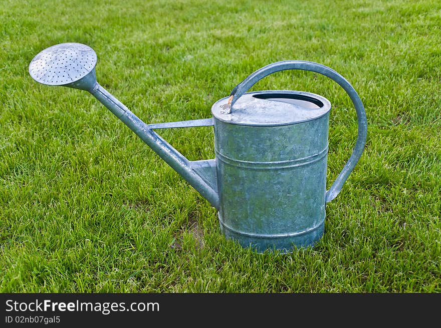 Garden a watering can to water a lawn a grass