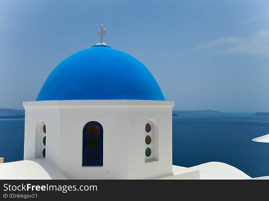 Santorini beautiful volcanic island in Greece landscape with blue churches, windmills and volcanic caldera