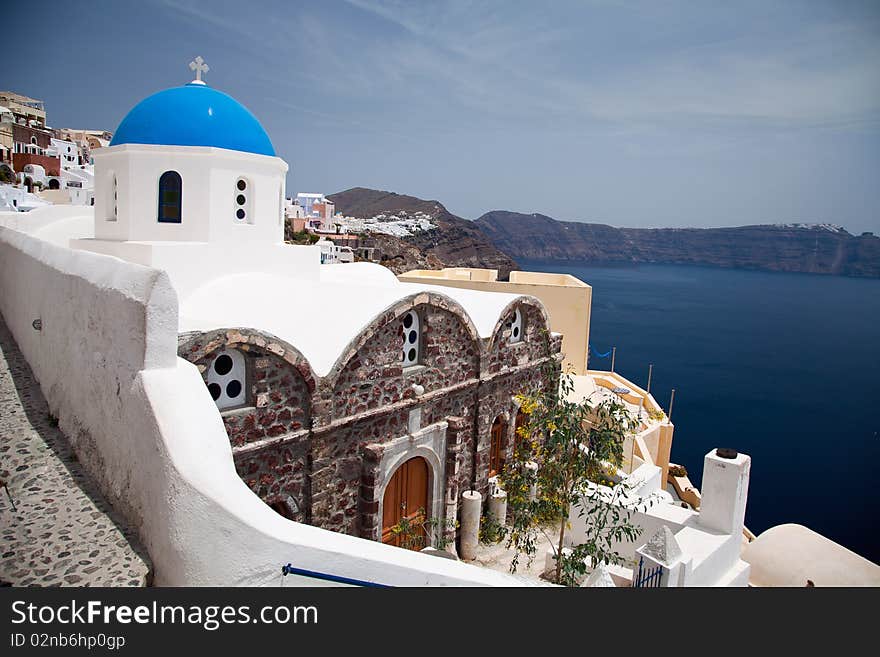 Santorini beautiful volcanic island in Greece landscape with blue churches, windmills and volcanic caldera